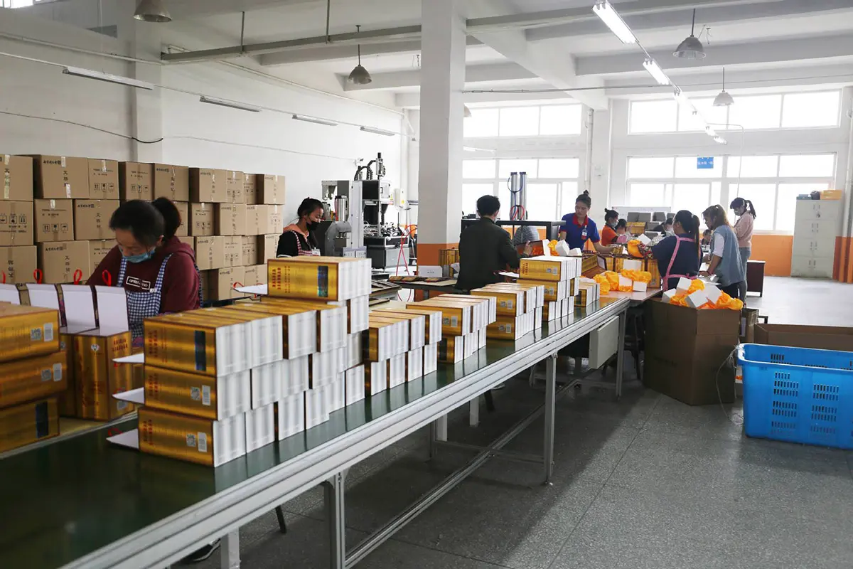 Custom boxes moving through the hand-assembly line