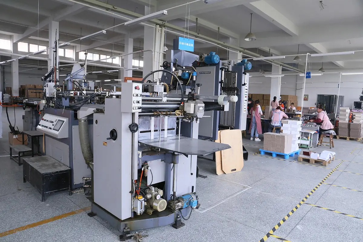 Industrial paper cutter used before box assembly