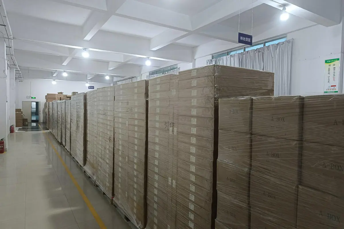 Finished cartons stacked for count and condition checks