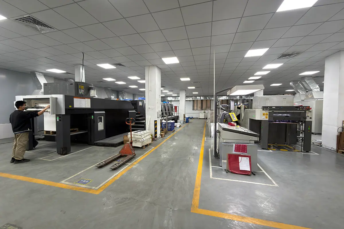 Packaging workshop floor showing production setup that affects unit cost