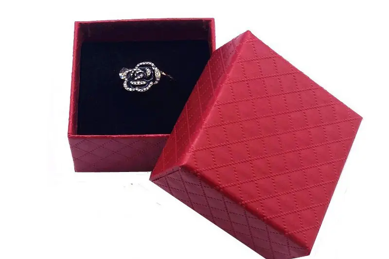 Compact jewelry packaging project background with rings necklaces and small accessories