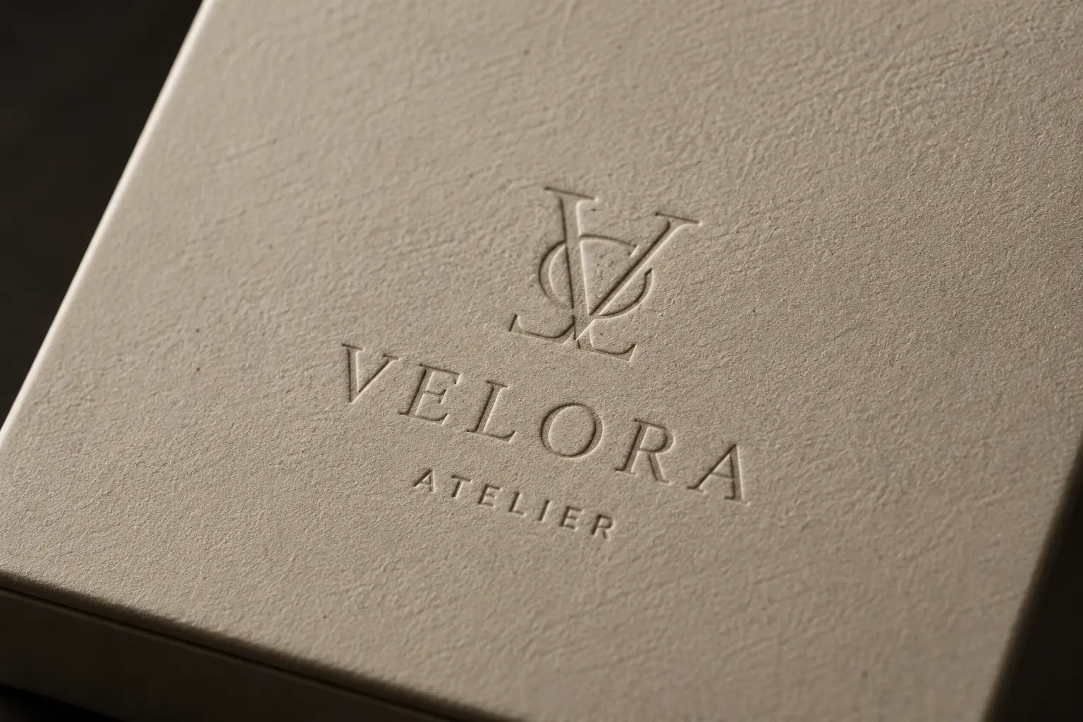 Debossed logo on specialty paper packaging