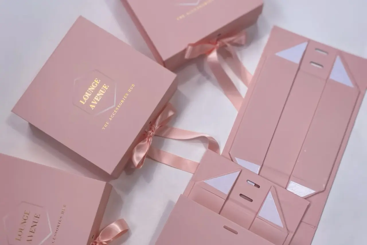 Custom pink foldable magnetic boxes in flat and assembled forms