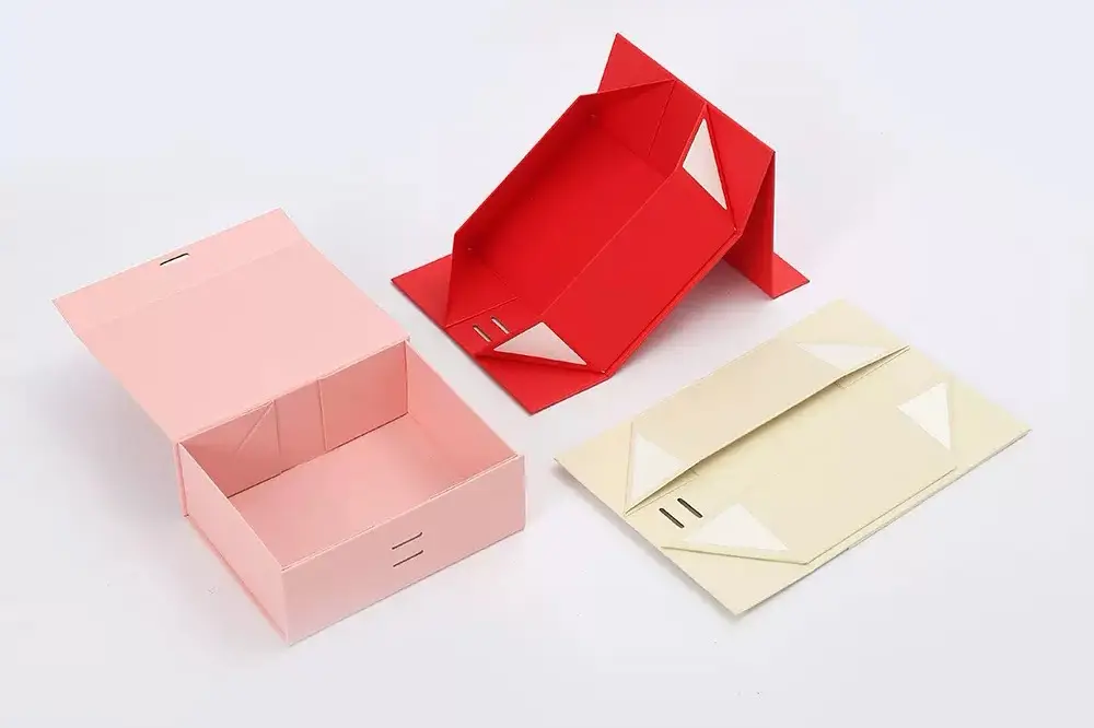 Foldable magnetic box shown flat, partially formed and assembled