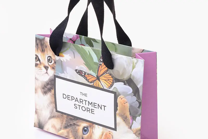 Custom floral paper shopping bags with rope handles